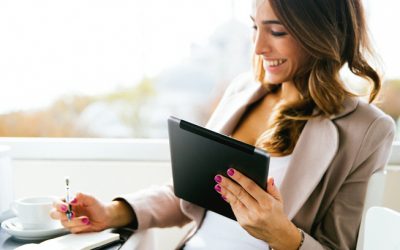 Business woman using mobile device to apply for financing